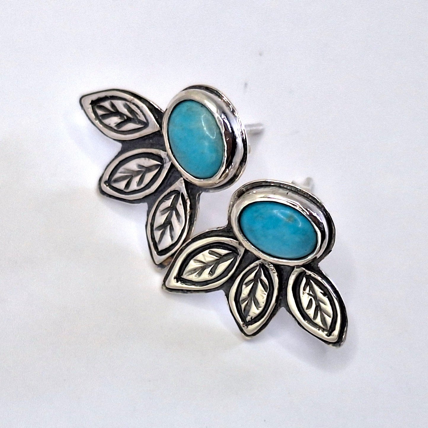 Aros turquesa hojas pegados