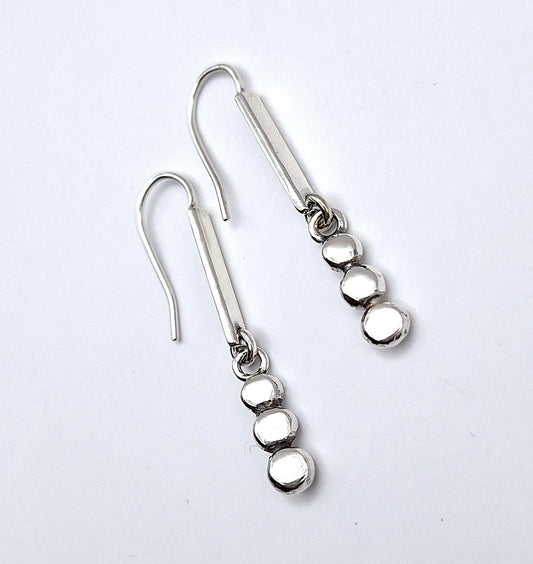Aros palitos y tachas colgantes